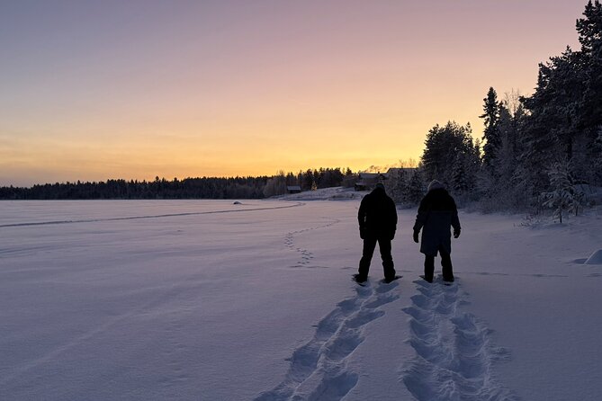 Arctic Reindeer Farm Experience with Snowshoeing in the Wild - Snowshoes across a frozen lake