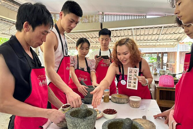 Authentic Thai Cooking Class and Farm Visit in Chiang Mai - Eating in the bamboo hut