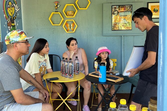 Bee Farm Ecotour and Honey Tasting in Waialua, North Shore Oahu - Holding a frame of raw honeycomb