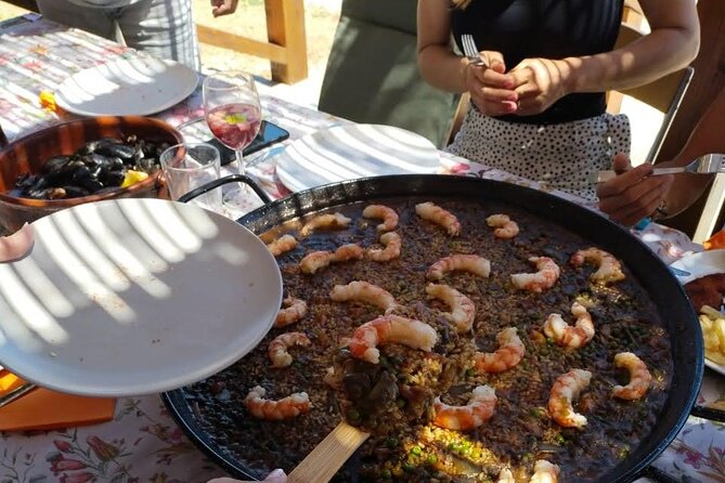 Chefcooking Paella from our Andalusian Grandmother at a Family Farm - Sangria, local starters, and a long Spanish lunch