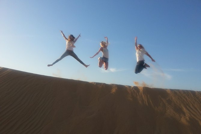 Dubai Desert Morning Tour in 4WD Vehicle: Camel Ride, Quad Bike Tour, Sandboarding, and Camel Farm - Sandboarding down the dunes