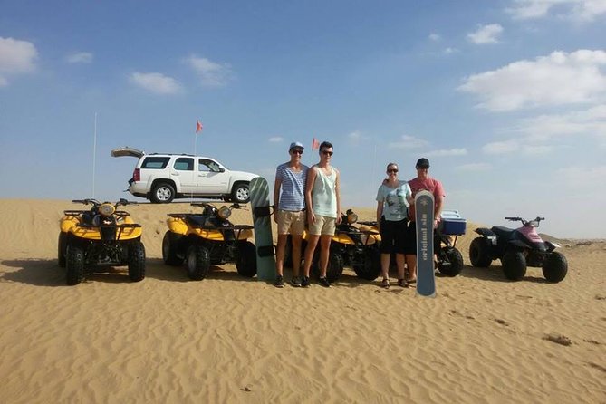 Dubai Desert Morning Tour in 4WD Vehicle: Camel Ride, Quad Bike Tour, Sandboarding, and Camel Farm - Quad biking over the desert tracks