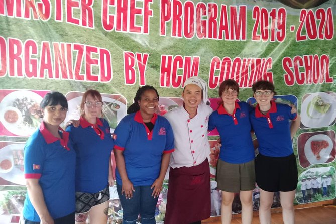 Farm-To-Table Healthy Cooking Class in Ho Chi Minh City - Gathering vegetables with a basket and scissors