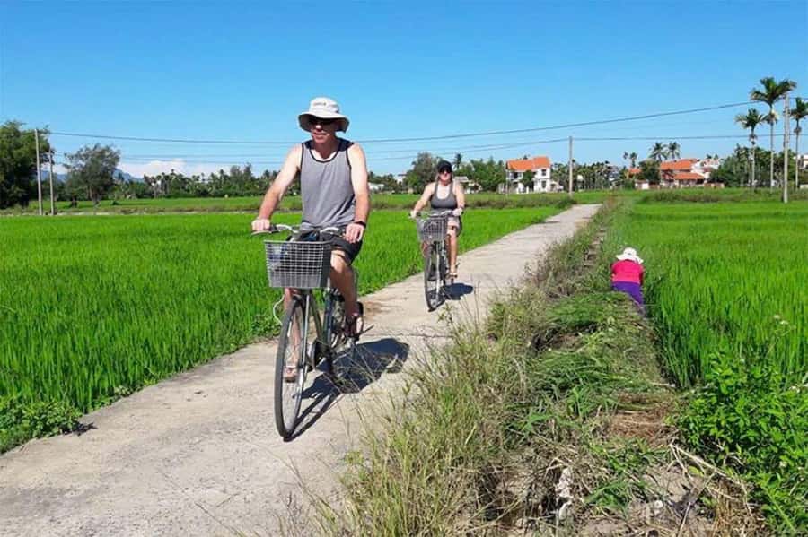 Hoi An: Countryside Bicycle Tour with Farm, Basket Boat Ride - Paddling through the water coconut palm forest