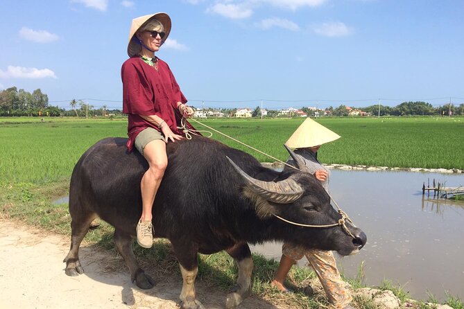 Hoi An Rice Farm Tour and Buffalo Riding with Local Home Meal - Putting on the clothes of a Vietnamese farmer