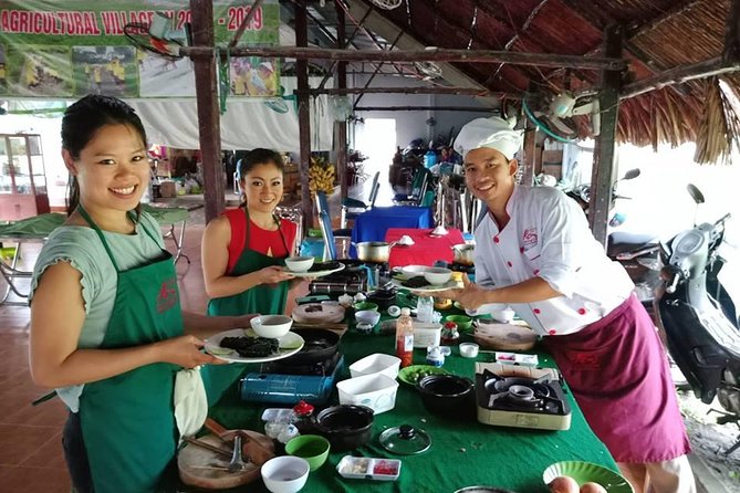 Market to Farm to Table Cooking Class in saigon - Picking vegetables and herbs on the farm