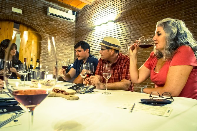 Montserrat & Winery Visit Tour with Traditional Farmhouse Lunch - A family winery and four Catalan pours