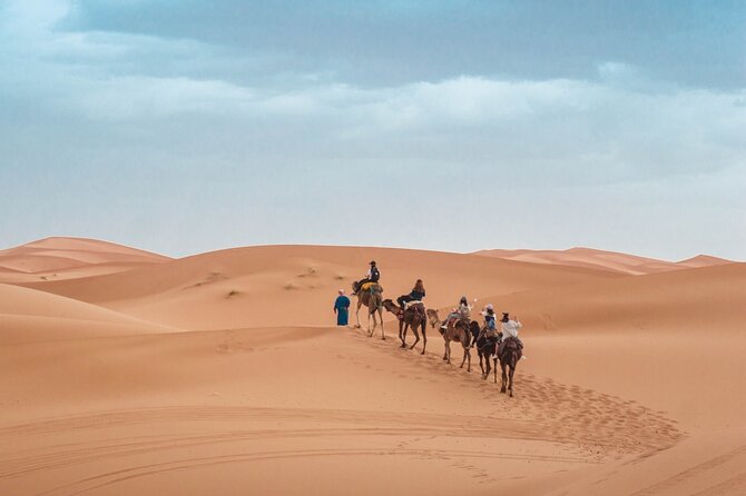 Morning Desert Safari From Abu Dhabi -Camel Ride,Sand Boarding,Camel Farm Visit - Arabic dress, coffee, dates, and a short camp stop