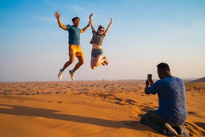 "Morning Desert Safari with Camel Farm visits & Arabic Treats" - Sandboarding on golden slopes