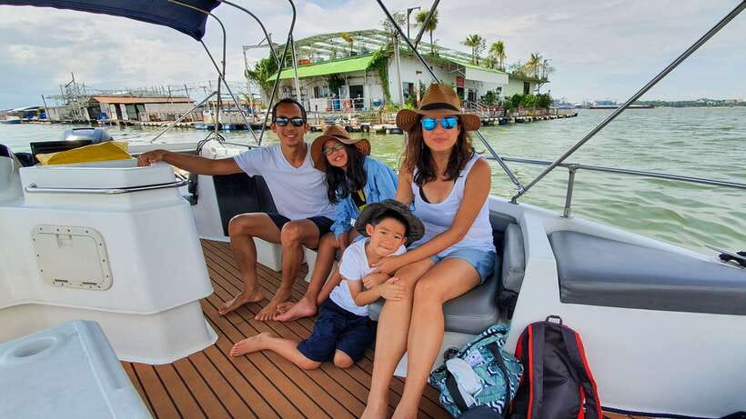 Singapore: Guided Boat Tour and Kelong Fish Farm Visit - Leaving the city behind on a fine catamaran