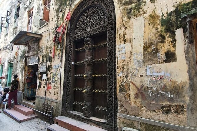 Stone City, Spice Farm and Prison Island Full Day Tour - Walking through Stone Town’s market and old quarters