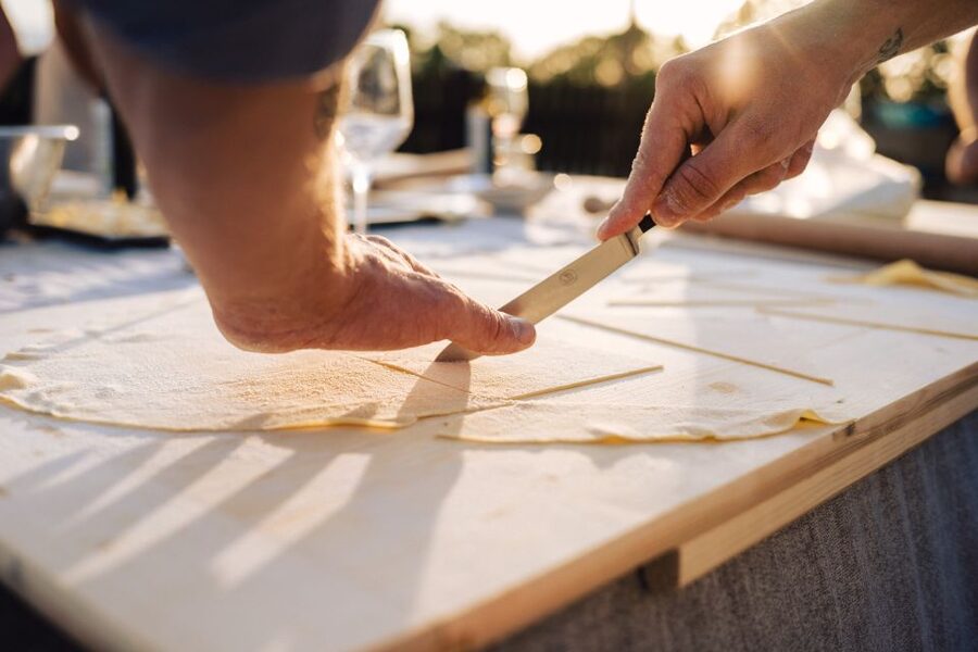 Volterra: Fresh Pasta Cooking Class at a Tuscan Farmhouse - From work station to family-style meal