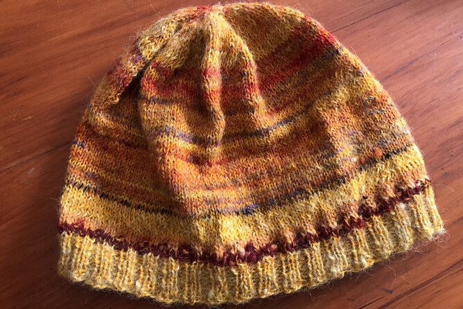 Wool Sheep Farm Experience with Handmade Wool Hat in New Zealand - Choosing your own woolly hat
